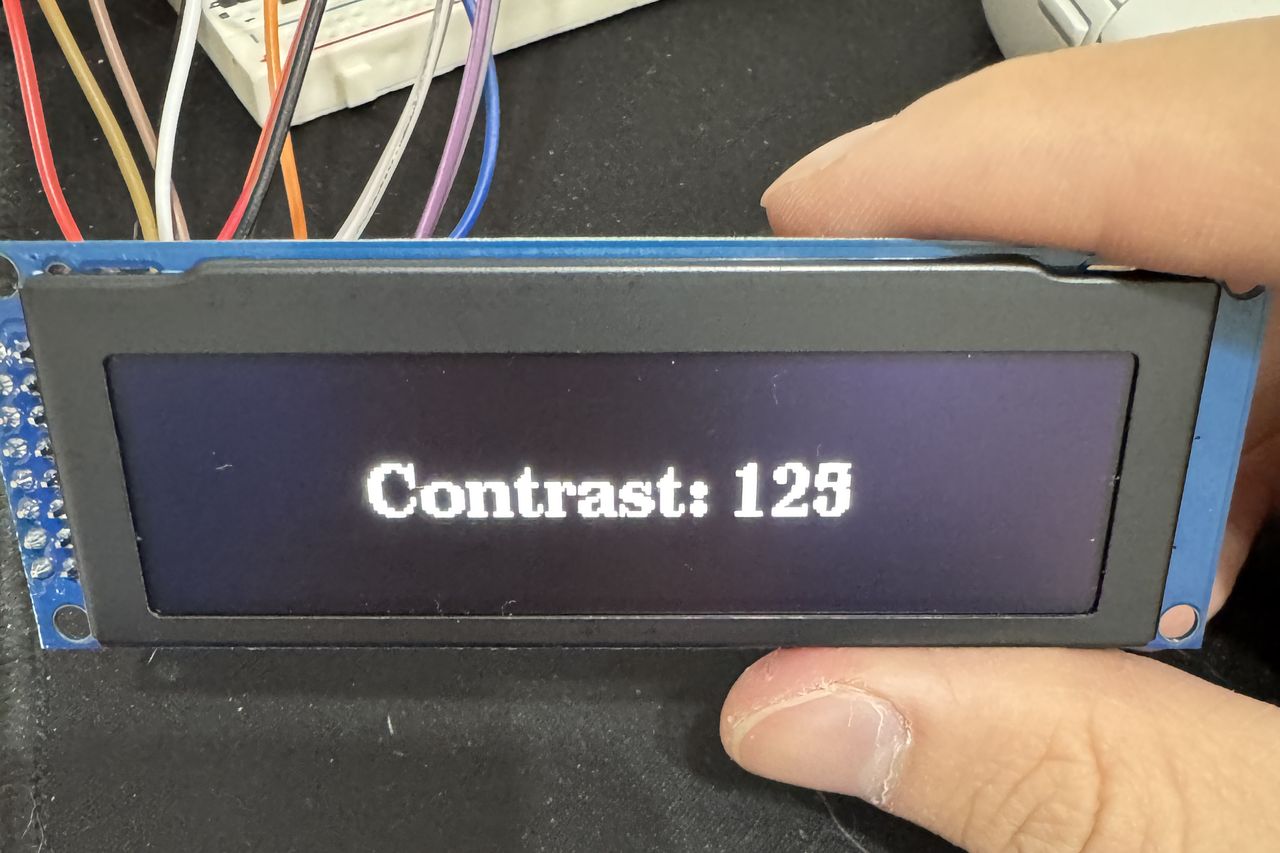 The 256 by 64 OLED running on its own, checking contrast before anything else was wired to it