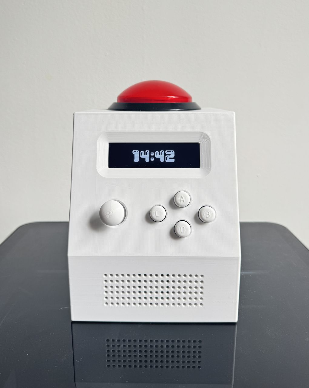 The finished unit from the front, display lit and the arcade button on top